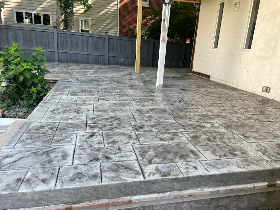 Stamped concrete patio installed by Coaty and the Crew in Louisville